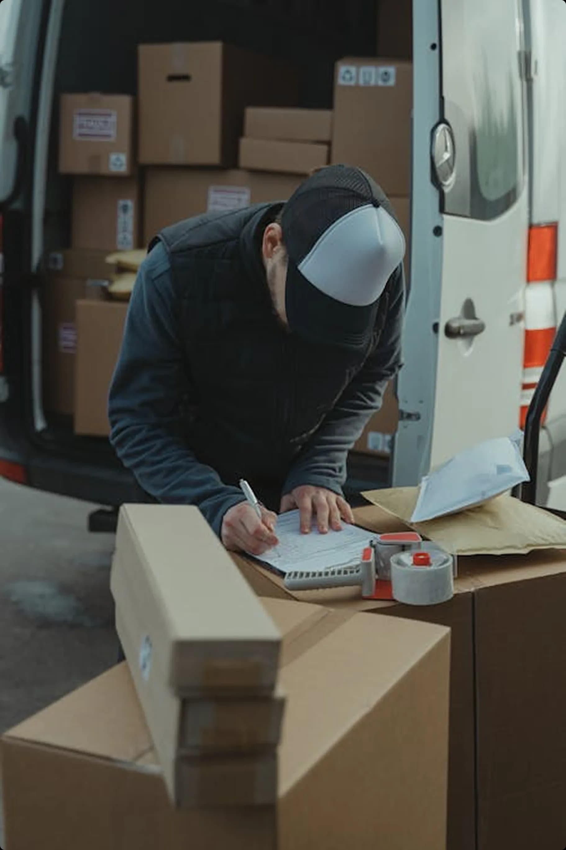 Trucks and warehouse staff handling freight documents